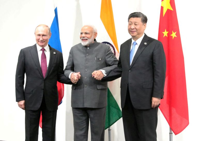 FILE PHOTO: Russia's President Putin, India's Prime Minister Modi and China’s President Xi attend a meeting on the sidelines of the G20 summit in Osaka