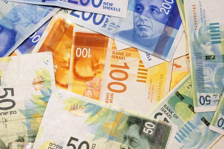 Israeli money stack of the new Israeli money bills (banknotes) of 50, 100 and 200 shekel. New Israeli Shekel series C.
