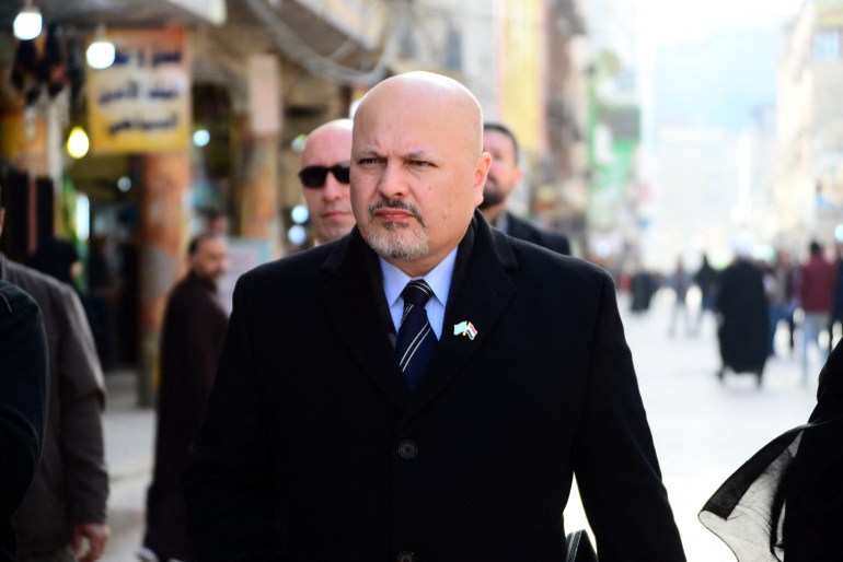 British lawyer Karim Asad Ahmad Khan walks in the streets of the holy city of Najaf in central Iraq during his visit to the war-torn country's Shiite Muslim Grand Ayatollah Ali Sistani on January 23, 2019. Khan, an ex defence lawyer of Liberian former President Charles Taylor, heads a United Nations team authorized over a year ago to investigate the massacre of the Yazidi minority and other atrocities by jihadists in Iraq. The UN Security Council adopted a resolution in September 2017 to bring those responsible for Islamic State group war crimes to justice -- a cause championed by Nobel Peace Prize winner Nadia Murad and international human rights lawyer Amal Clooney. (Photo by Haidar HAMDANI / AFP)