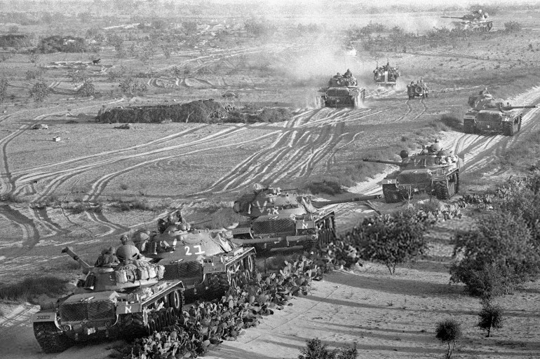 RAFAH, GAZA STRIP - JUNE 5, 1967: Israeli armor advances against Egyptian troops at the start of the Six-Day War June 5, 1967 near Rafah, Gaza Strip. Thirty-eight years after Israel captured the Gaza Strip from the Egyptians during the campaign, the Jewish state looks poised to leave the populous Palestinian territory as Prime Minister Ariel Sharon's disengagement plan approaches its August 15, 2005 implementation. (Photo by Shabtai Tal/GPO via Getty Images)