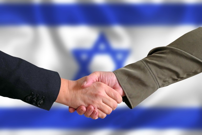 handshake against the background of the Israeli flag, support for Israeli citizens after the bombing of Hamas concept, closeup