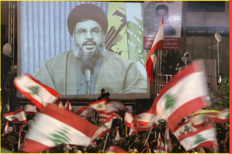 Supporters of the pro-Syrian Lebanese opposition wave national flags during the seventh day of a rally held to demand the resignation of the U.S.-backed government as Hezbollah leader Sayyed Hassan Nasrallah speaks on a screen in central Beirut December 7, 2006. REUTERS/Mohamed Azakir (LEBANON)