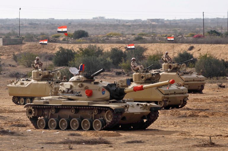 Egyptian tanks are deployed near Egypt's northern Rafah border crossing with Gaza on October 31, 2023, amid continuing battles between Israel and the Palestinian militant group Hamas. (Photo by Khaled DESOUKI / AFP)