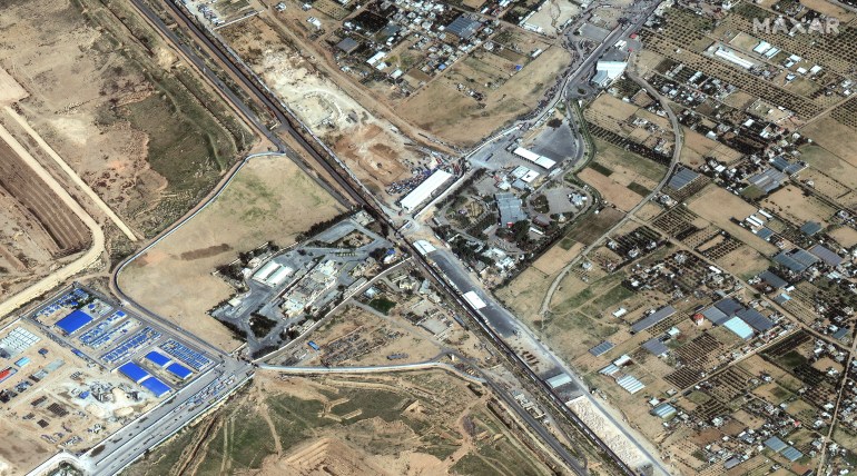 This handout satellite image courtesy of Maxar Technologies shows Rafah border crossing at the Egypt-Gaza Strip border on November 26, 2023. A truce between Israel and Hamas held on November 28, 2023 for a fifth day after the deal was extended to allow further releases of Israeli hostages and Palestinian prisoners. Gaza militants took about 240 captives from southern Israel in an unprecedented October 7 attack that Israeli officials say killed around 1,200 people, most of them civilians. In response, Israel has vowed to eliminate Hamas and unleashed an aerial bombing campaign and ground invasion of Gaza that the Hamas government says has killed nearly 15,000 people, also mostly civilians. (Photo by Satellite image ©2023 Maxar Technologies / AFP) / RESTRICTED TO EDITORIAL USE - MANDATORY CREDIT "AFP PHOTO / SATELLITE IMAGE ©2023 MAXAR TECHNOLOGIES" - NO MARKETING NO ADVERTISING CAMPAIGNS - DISTRIBUTED AS A SERVICE TO CLIENTS - RESTRICTED TO EDITORIAL USE - MANDATORY CREDIT "AFP PHOTO / Satellite image ©2023 Maxar Technologies" - NO MARKETING NO ADVERTISING CAMPAIGNS - DISTRIBUTED AS A SERVICE TO CLIENTS