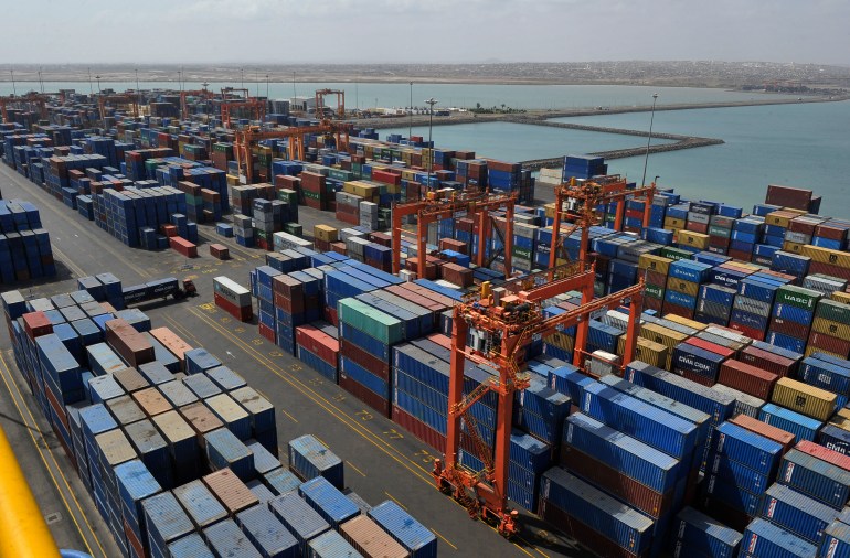A picture shows containers and a general view of the port of Djibouti, on March 27, 2016. The Port of Djibouti is located at the southern entrance to the Red Sea, at the intersection of major international shipping lines connecting Asia, Africa and Europe. (Photo by Simon MAINA / AFP)