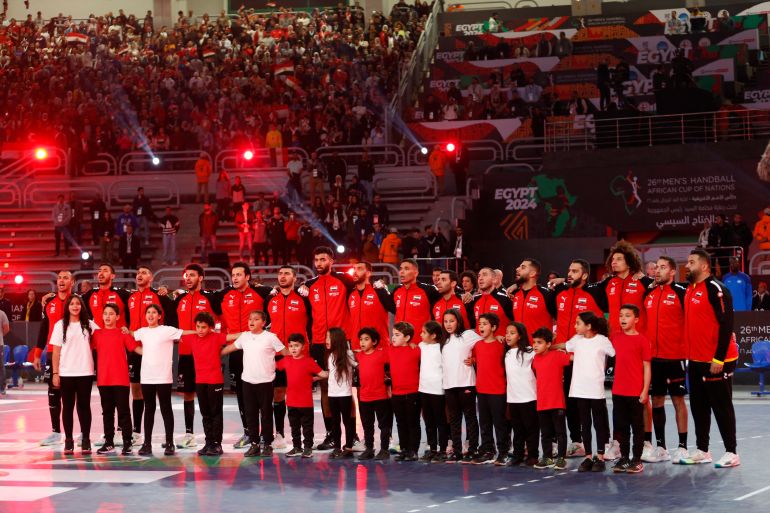 Handball - African Championship - Final - Egypt v Algeria - Cairo Stadium Indoor Hall, Cairo, Egypt - January 27, 2024 Egypt players line up during the national anthems before the match REUTERS/Amr Abdallah Dalsh