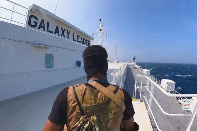 A Houthi fighter stands on the Galaxy Leader cargo ship in the Red Sea in this photo released November 20, 2023. Houthi Military Media/Handout via REUTERS THIS IMAGE HAS BEEN SUPPLIED BY A THIRD PARTY