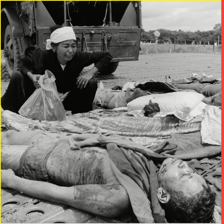 Vietnam War. South Vietnamese soldiers widow weeps over the body of her husband, one of the South Vietnamese Army casualties suffered in the war with the Viet Cong. 1965.