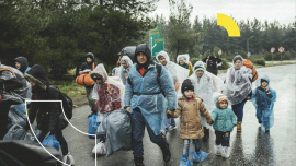 Incoming refugees in rain, refugee camp in Idomeni, border with Macedonia, Greece