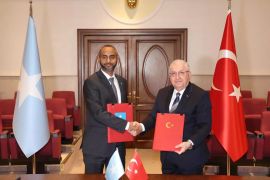 ANKARA, TURKIYE - FEBRUARY 08: (----EDITORIAL USE ONLY - MANDATORY CREDIT - 'TURKISH NATIONAL DEFENSE MINISTRY / HANDOUT' - NO MARKETING NO ADVERTISING CAMPAIGNS - DISTRIBUTED AS A SERVICE TO CLIENTS----) Turkish Defense Minister Yasar Guler (R) poses for a photo with Minister of Defense of Somalia Abdulkadir Mohamed Nur (L) during the signing ceremony of Defense and Economic Cooperation Framework Agreement between two countries in Ankara, Turkiye on February 08, 2024. (Photo by Turkish National Defense Ministry / Handout/Anadolu via Getty Images)