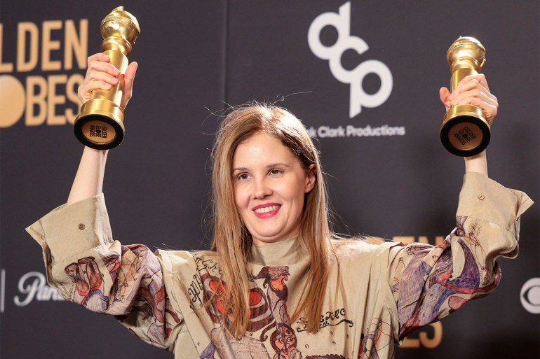 epa11063523 French director Justine Triet holds the Golden Globe awards for Best Screenplay - Motion Picture and Best Motion Picture Non-English Language for the film 'Anatomy of a Fall' in the press room during the 81st annual Golden Globe Awards ceremony at the Beverly Hilton Hotel in Beverly Hills, California, USA, 07 January 2024. Artists in various film and television categories are awarded Golden Globes by the Hollywood Foreign Press Association. EPA-EFE/ALLISON DINNER
