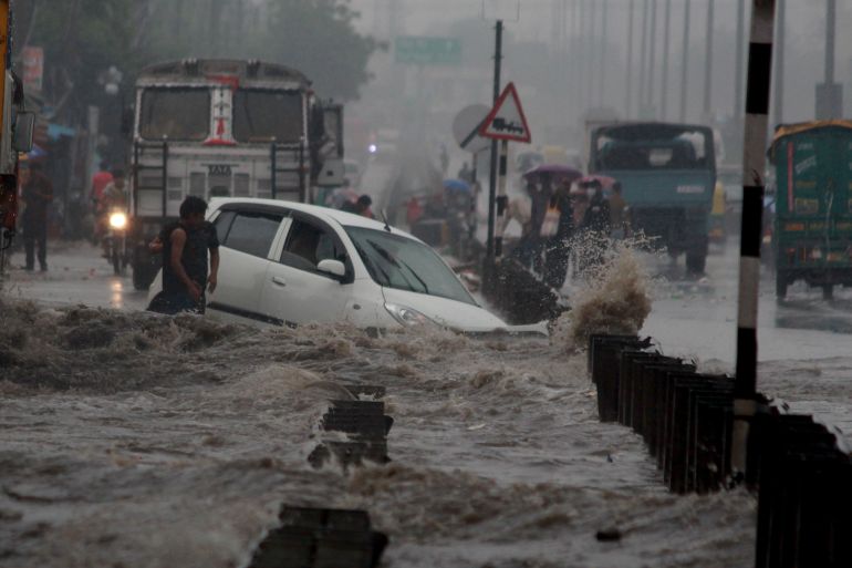 impact of climate change. After heavy rain waterlogging like flood on delhi - gurgaon - jaipur expressway in Millennium City Gurgaon. Haryana, India. August 21, 2021.