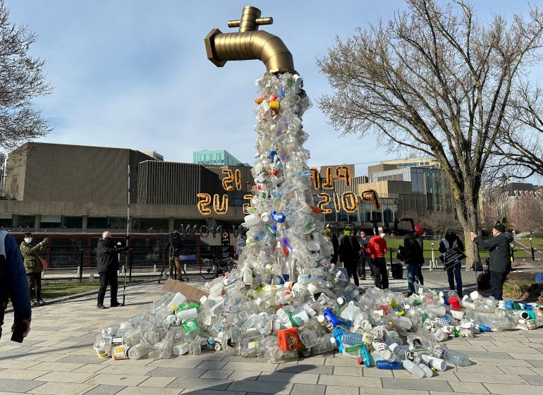 FILE PHOTO: A prop depicting a water tap with cascading plastic bottles is displayed by activists near the Shaw Centre venue of penultimate negotiations for the first-ever global plastics treaty, in Ottawa, Ontario, Canada April 23, 2024. REUTERS/Kyaw Soe Oo/File Photo
