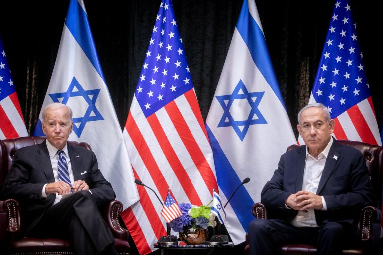 U.S. President Joe Biden, left, pauses during a meeting with Israeli Prime Minister Benjamin Netanyahu, right, to discuss the war between Israel and Hamas, in Tel Aviv, Israel, Wednesday, Oct. 18, 2023. Miriam Alster/Pool via REUTERS