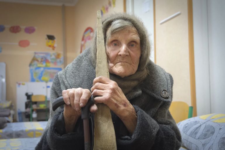 "In this photo provided by the Ukrainian National Police of Donetsk region, 98-year-old Lidia Lomikovska sits in a shelter after she escaped Russian-occupied territory in the Donetsk region, Ukraine, April 26, 2024. Lomikovska left the frontline town of Ocheretyne last week by walking almost 10 km (6 miles) alone, after Russian troops entered it and fighting intensified. (Ukrainian National Police of Donetsk region via AP)"