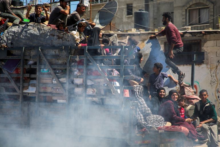 Palestinians travel in a truck as they flee Rafah after Israeli forces launched a ground and air operation in the eastern part of the southern Gaza city, amid the ongoing conflict between Israel and Hamas, in Rafah, in the southern Gaza Strip May 8, 2024. REUTERS/Hatem Khaled