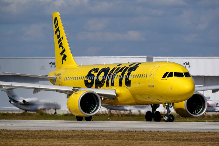 A Spirit Airlines Airbus A320 prepares to take off from Fort Lauderdale-Hollywood International Airport, Tuesday, Jan. 19, 2021, in Fort Lauderdale, Fla. (AP Photo/Wilfredo Lee)